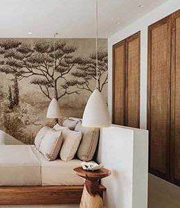 Chambre au style scandinave décorée par Cachet d’Intérieur, avec mobilier en bois clair et suspension design.